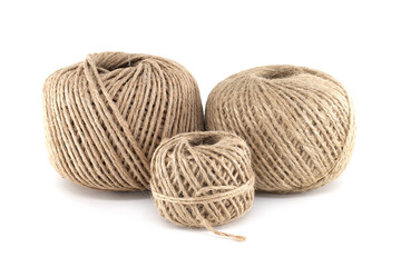 Three balls of twine in different sizes arranged on a clean, white background, isolated.