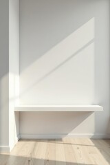 Fototapeta premium Minimalist White Shelf Against a Sunlit Wall in a Room with Light Wood Flooring