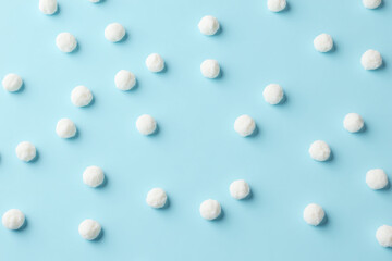 bunch of white ice cream balls on a blue background