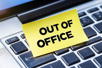 Temporary Absence: A Laptop Keyboard Displaying an 'Out of Office' Notice
