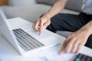 Fototapeta premium Business man working using laptop computer Hands typing keyboard. Professional investor working start up project. business planning in office. Technology business Concept