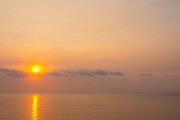 Fototapeta premium Enjoy panoramic views of the skyline . Sunset in the evening sky with colorful clouds and beautiful cloud patterns Amidst the soft golden light 