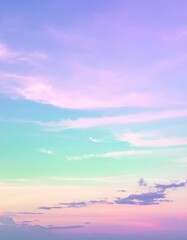 Fototapeta premium A breathtaking sky painted in soft pink and vibrant blue hues, with wispy clouds gently blending the colors, creating a serene and dreamy atmosphere.