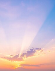 Fototapeta premium A breathtaking sunset paints the sky in vibrant hues of orange, pink, and purple, as the sun's golden rays pierce through fluffy, textured clouds.