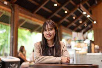 young woman in cafe looking at camera