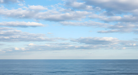 Obraz premium Ocean View with Blue Sky and Clouds