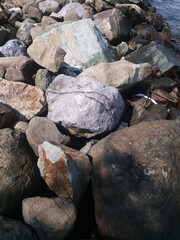 Stone Podium on seaside Sea with daylight, well display Product Background and text on free space