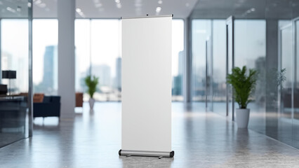 A modern office space features a blank retractable banner stand for advertisement display purpose.