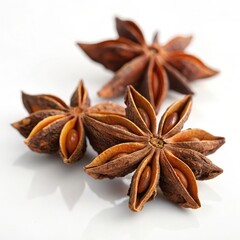 Obraz premium Close-up high contrast image of star anise spice showcasing its unique star shape and rich brown coloration