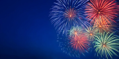 Blue fireworks bursting in dark sky celebration