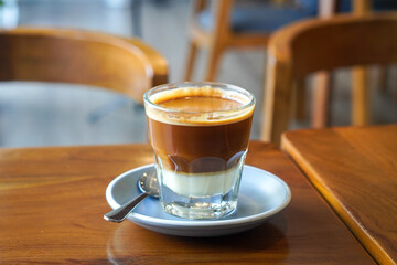 Hot long black coffee with sweet vanilla condensed milk, captured on May 14, 2025. A bold espresso...