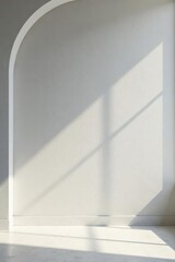 Obraz premium Arched wall with soft sunlight illuminating a minimalist interior space