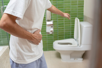 Constipation and diarrhea in bathroom. Hurt man touch belly  stomach ache painful. colon...