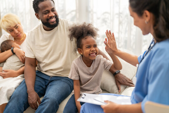 African girl high five with doctor after recovery, happy child leaving hospital healthy, pediatric care success, flu treatment completed, positive experience in children hospital, health insurance