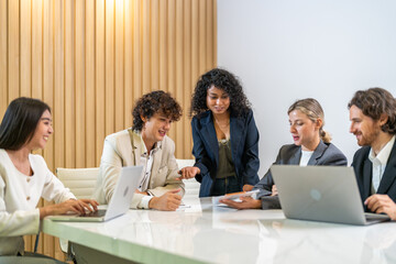 Leadership training, executive communication and team development in progress with diverse professionals in coaching seminar, strategic thinking and interpersonal skills in a modern workplace