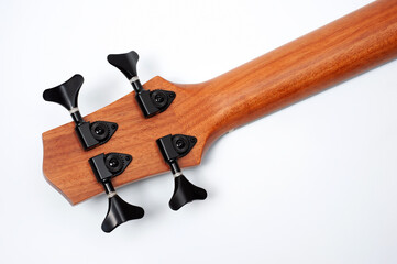 Four-string bass ukulele with wooden body and built-in tuner and pickup.