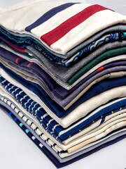 Stack of neatly folded colorful shirts ready for everyday wear