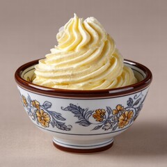 Pale Yellow Buttercream Frosting in a Decorative Bowl