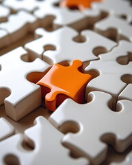 Close-up of an orange puzzle piece fitting into a white puzzle, symbolizing uniqueness, problem solving, teamwork, strategy, and the concept of completing the bigger picture.

