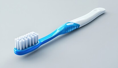 A modern toothbrush, angled, with a blue and white handle.  Dense bristles for cleaning teeth