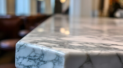 A marble counter top with a chair on the left side