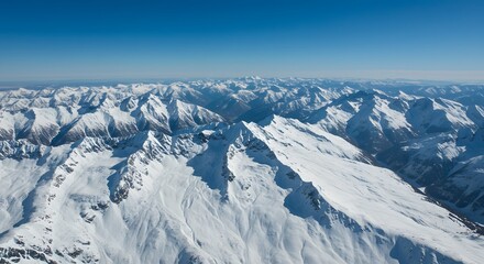 Fototapeta premium Snowy Mountain Range Panorama Under a Clear Blue Sky