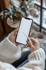 Woman using smartphone with stylus