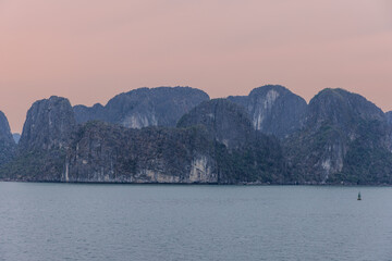 Halong Ha Long Bay Hanoi this Vietnamese wonder is littered with mountains and Rock cliffs popping...