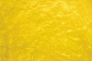 Yellow concrete stone texture for background in summer wallpaper. Cement and sand wall of tone vintage minimal.