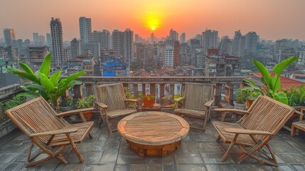 Urban rooftop patio at sunset, city view.