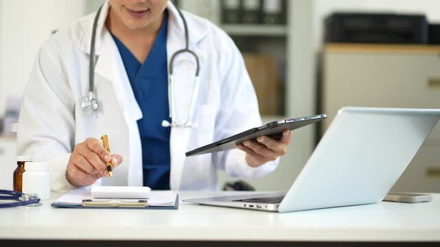 Doctor working in hospital use calculator, Healthcare and medical concept.