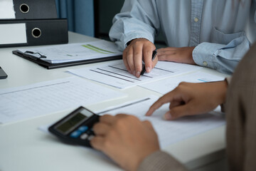 Businessman and businesswoman working together in an office