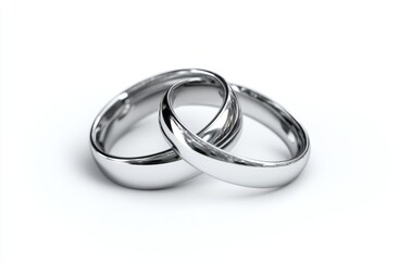 Interlocked Silver Rings Reflect Light on White Background, Symbolizing Commitment and Unity Rings Jewelry