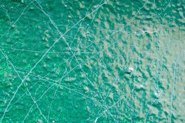 The texture of the green paint in close-up