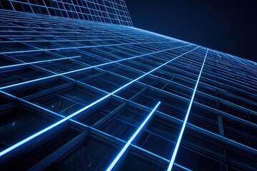 Obraz premium Modern skyscraper facade illuminated at night.