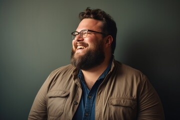 Plus size man portrait glasses smiling.