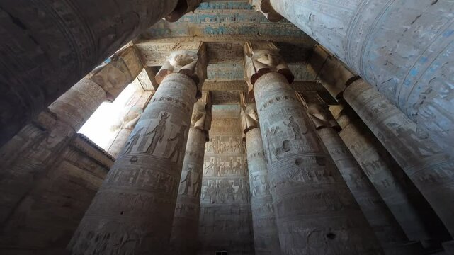 Upward View of Massive Columns in Dendera Temple of Hathor with hieroglyph carvings