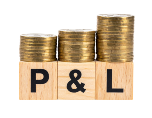 Wooden blocks labeled P & L topped with stacked gold coins symbolize profit and loss in finance.