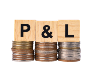 Wooden blocks with the letters P & L placed on stacked coins.