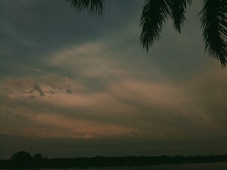 time lapse of clouds over the sunset