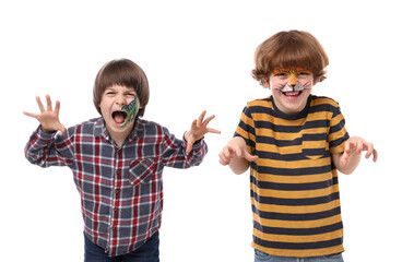 Cute boys with colorful face paintings posing on white background