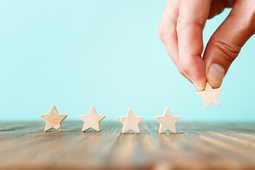 Fototapeta na wymiar Concept image of five star rating. Idea of quality and customer satisfaction