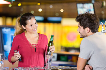 serving bottled beer to the customer