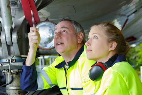 two aircraft engineers inspecting plane construction