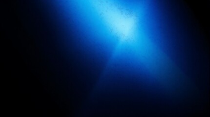 Abstract blue gradient background with dramatic lighting and textured surface for creative design