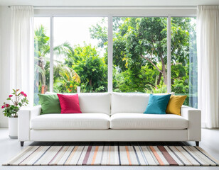 bright and inviting modern living room featuring white sofa adorned with colorful cushions, surrounded by lush greenery visible through large windows. serene atmosphere is enhanced by natural