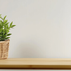 A cozy and modern decor scene with a wooden table, a plant in a woven pot, and a clean backdrop, evoking a sense of simplicity and freshness.