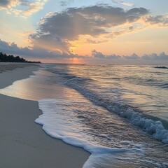 Sunrise on the beach and ocean waves on a tropical sea