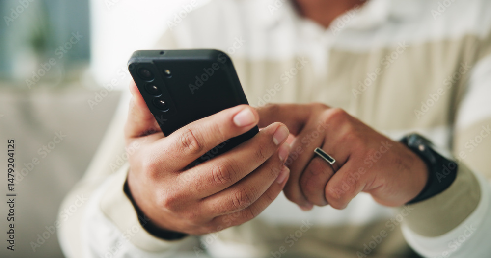 Poster Man, hands and scroll with phone on sofa for app download, playing online game and streaming service. Closeup, relax and person with smartphone in home for social media, reading ebook or dating site