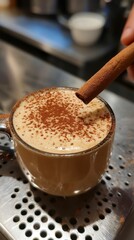 Cozy Cup of Coffee with Cinnamon Stick on Metal Counter